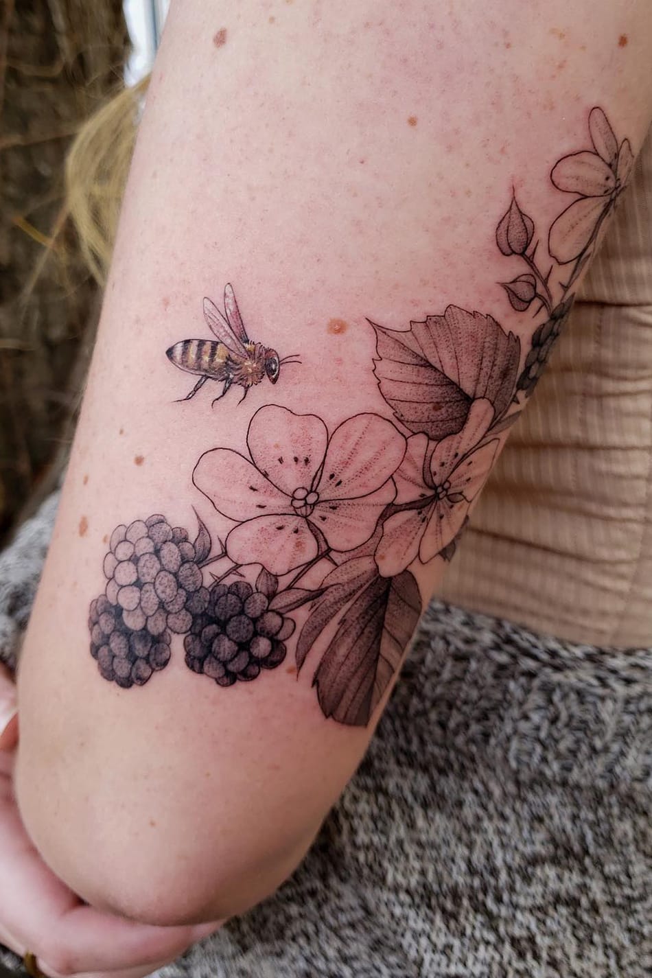 Bee tattoo on arm
