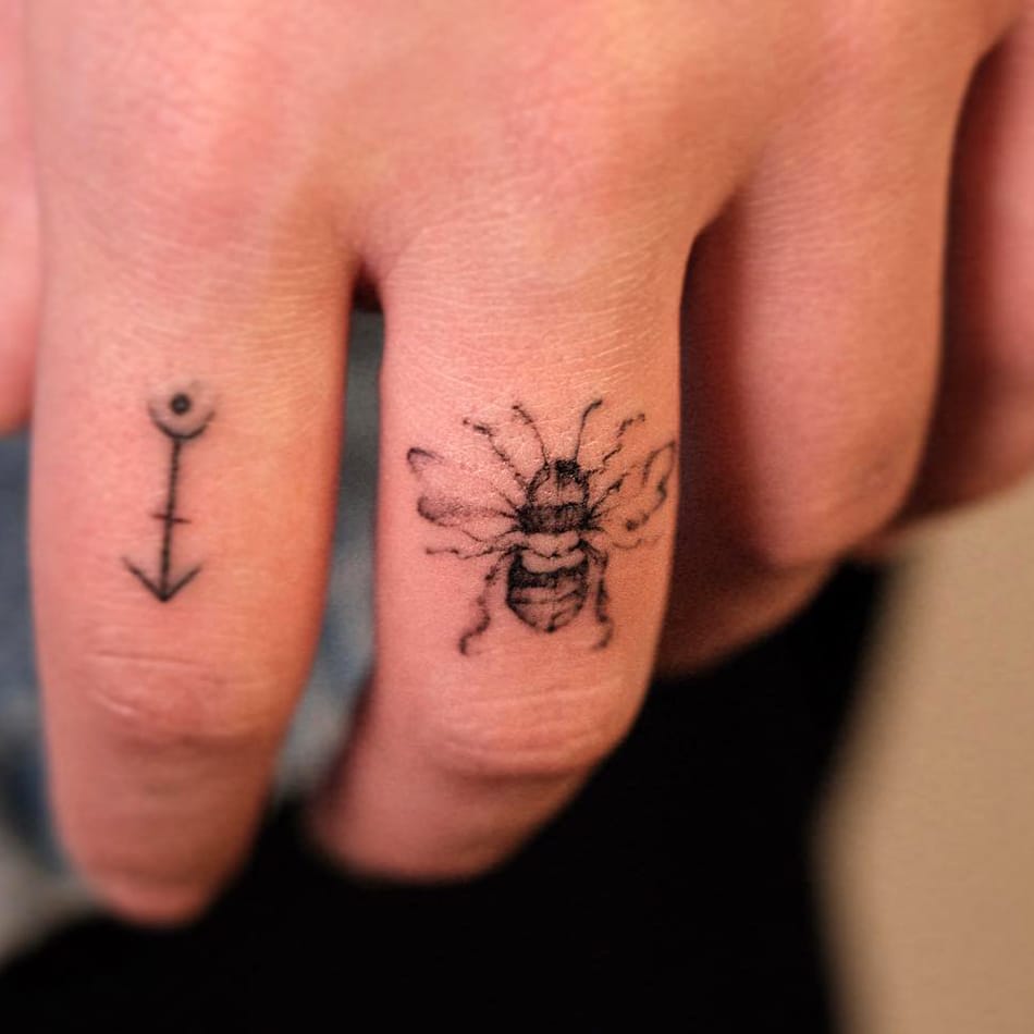 Bee tattoo on finger