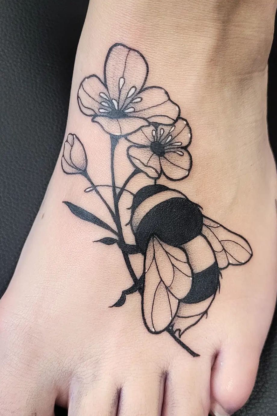 Bee tattoo on foot