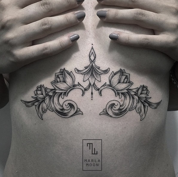 scrolling floral sternum tattoo