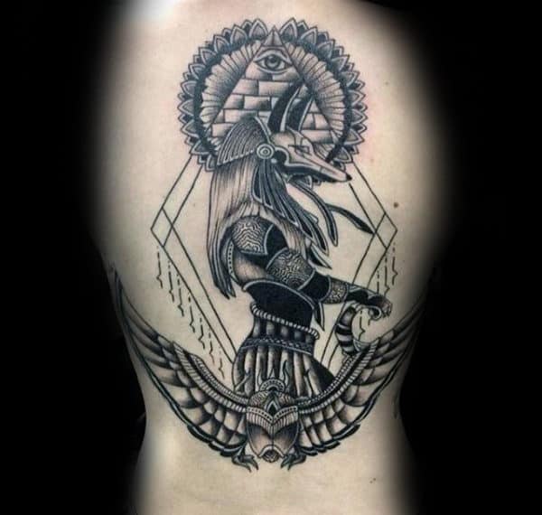 ancient egyptian themed mens anubis upper arm tattoo