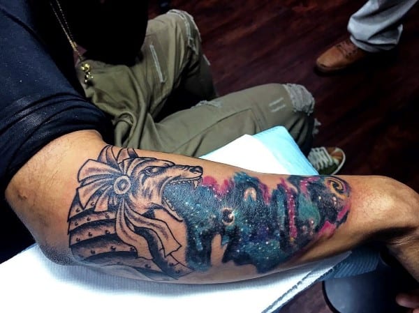 anubis night sky outer space tattoo on outer forearm