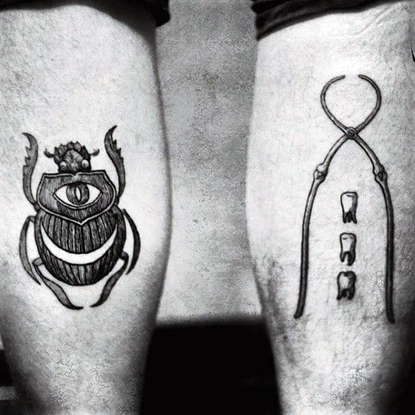 artistic scarab bettle eye mens back of leg tattoo ideas