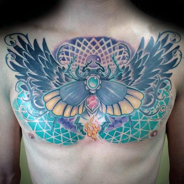 geometric mens scarab upper chest tattoo