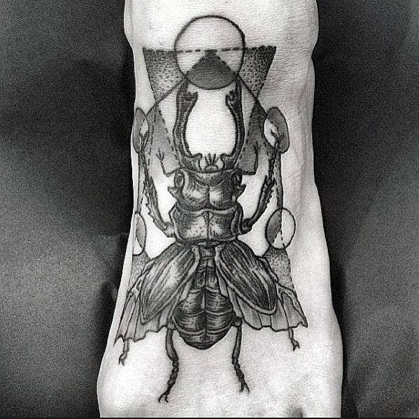 geometric scarab bettle foot tattoos for men