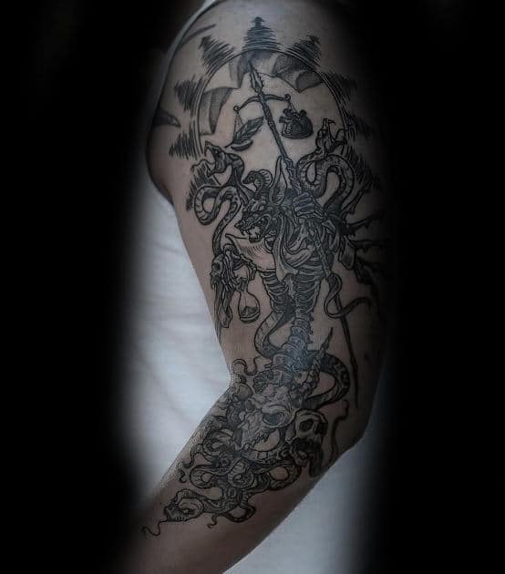 guy with anubis arm tattoo