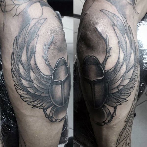 heavily shaded scarab mens knee and shin tattoo designs