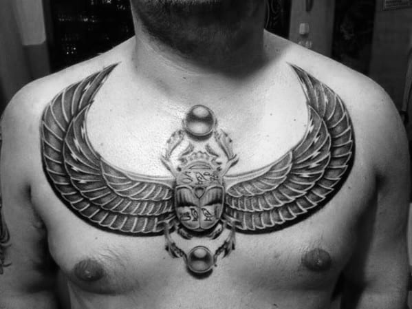 mens d scarab bettle upper chest tattoo