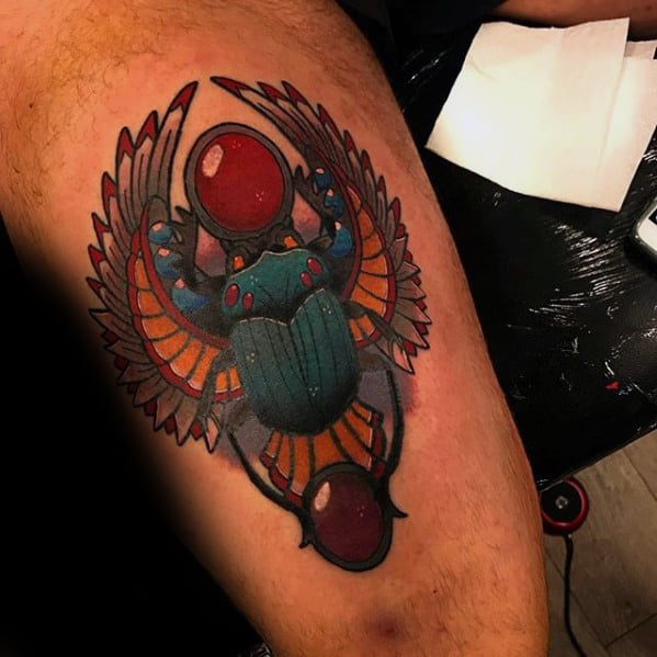 ornate scarab mens thigh tattoos