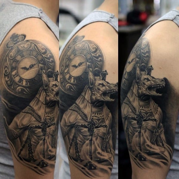 realistic d upper arm anubis tattoo on male
