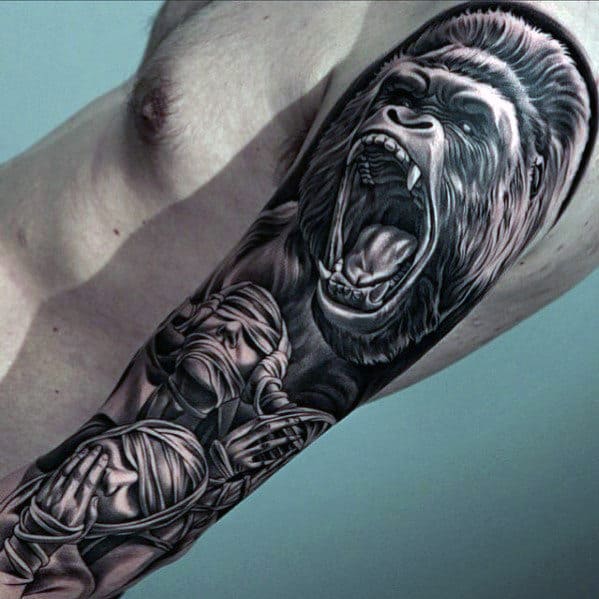 roaring gorilla with mummy mens full sleeve tattoo