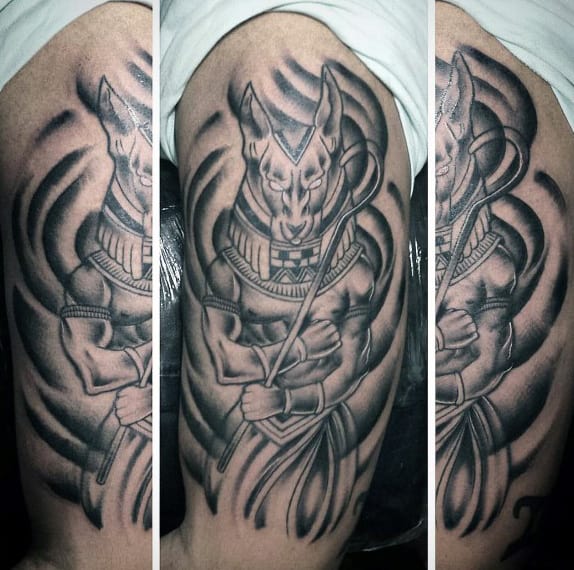 shaded black and grey mens anubis upper arm tattoo