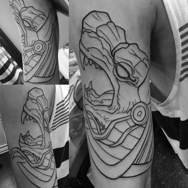 upper arm tattoo of anubis with outline design for guys
