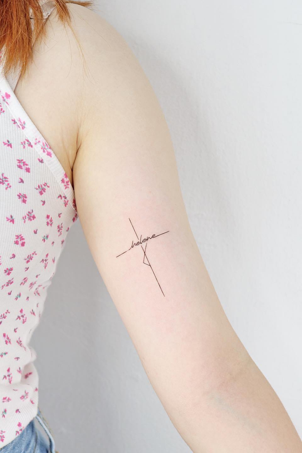 Small cross tattoo with name