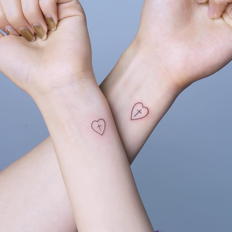 Small heart cross tattoo