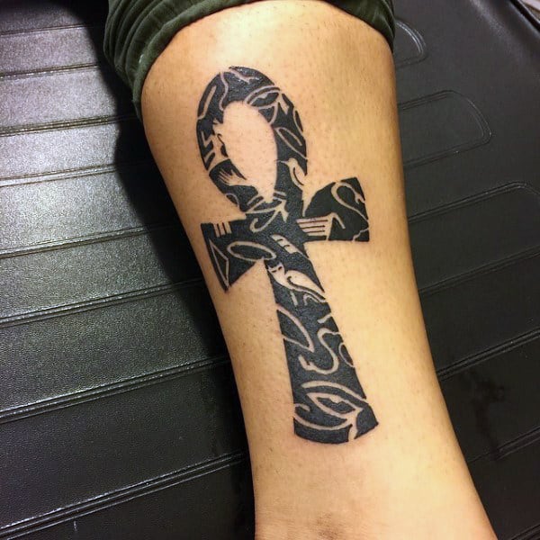 manly tribal ankh tattoo with black ink fore men on leg