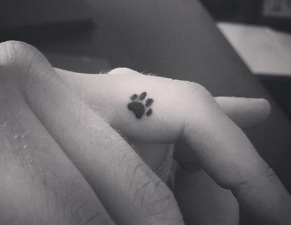 Dainty Dog Paw Finger Tattoo