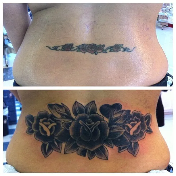 lower back black flower cover up tattoo design