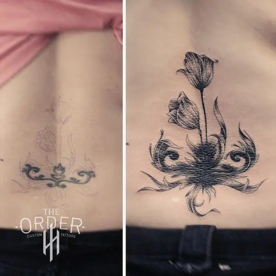lower back cover up black flower tattoo design