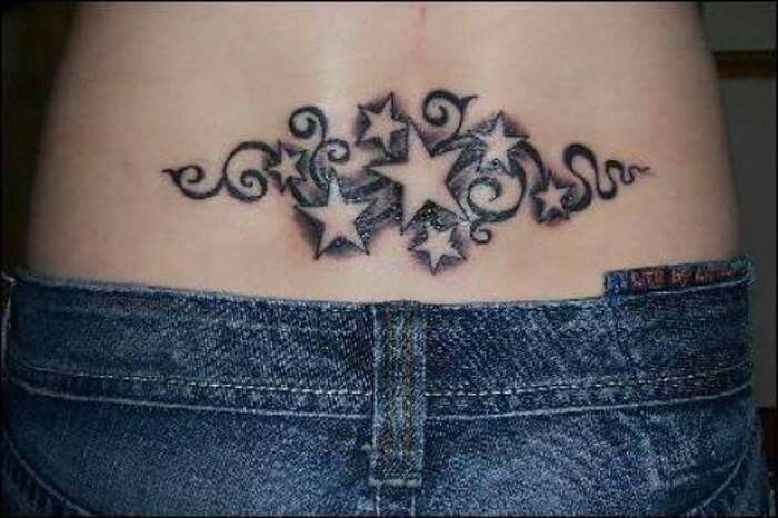 bow tattoo on lower back