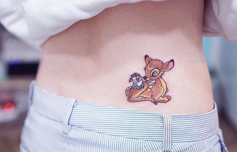 deer lower back tattoos