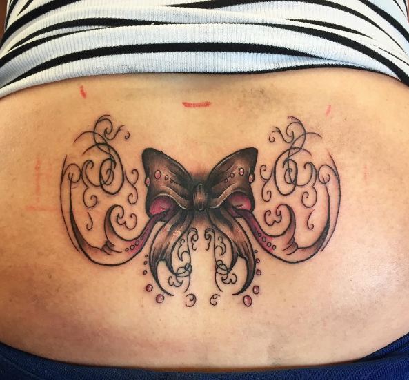 lower back bow tattoos