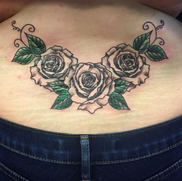 rose lower back tattoos