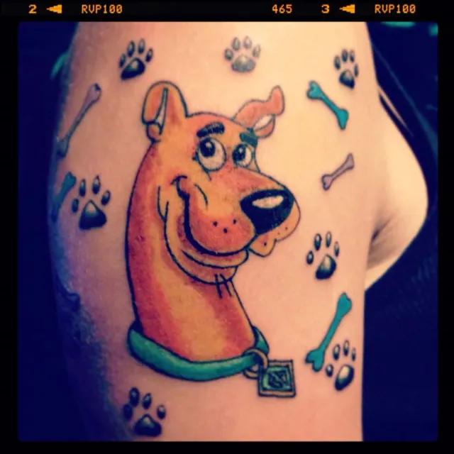 scooby doo with paws and bones tattoo design