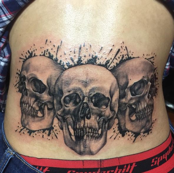 skull lower back tattoos