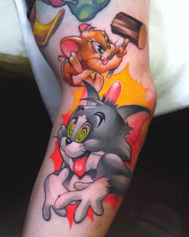 tom and jerry cartoon tattoo design on arm