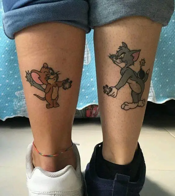 tom and jerry cartoon tattoos on calf
