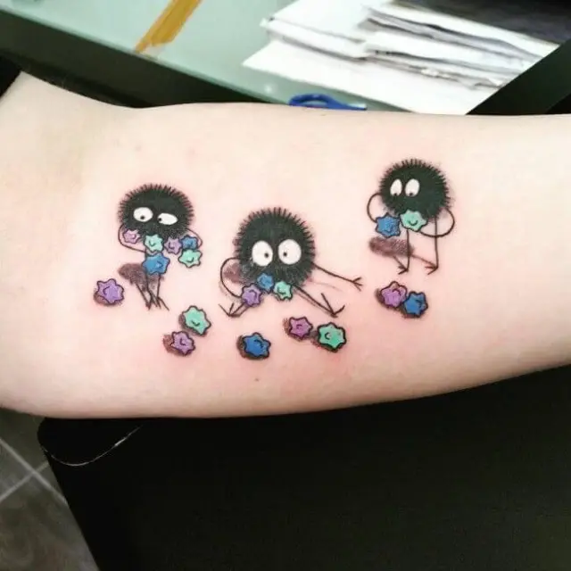 3d soot sprite tattoos on forearm