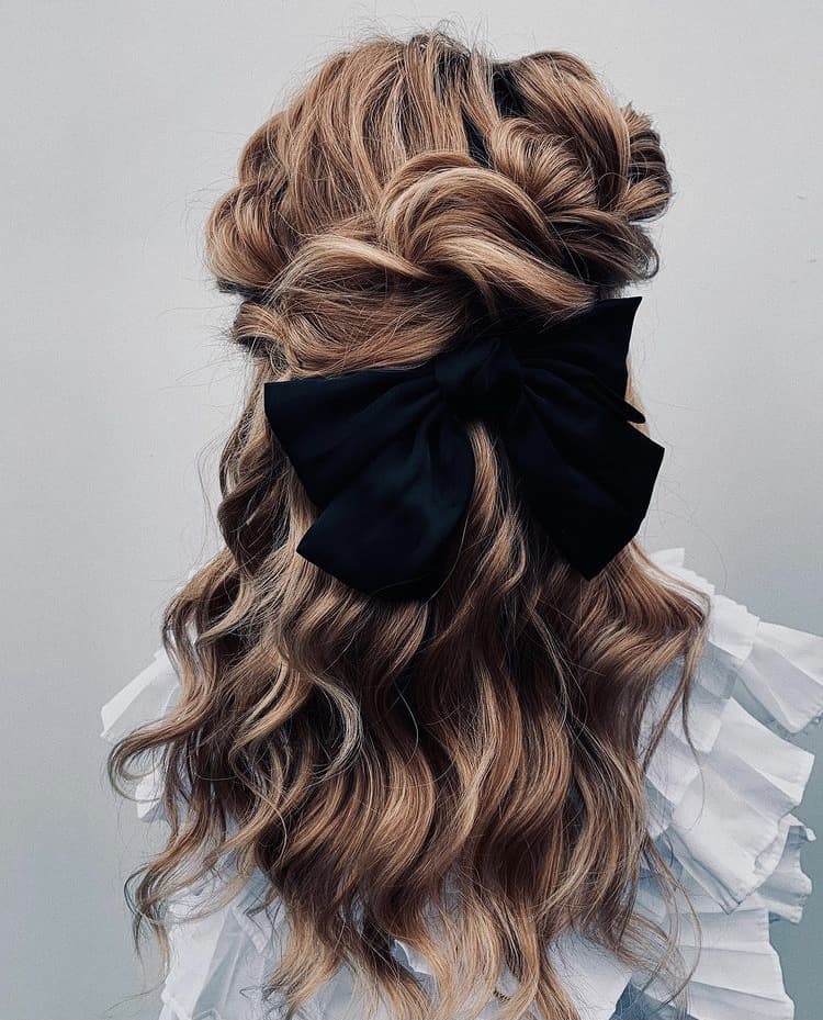 Half up hairstyle with a bow
