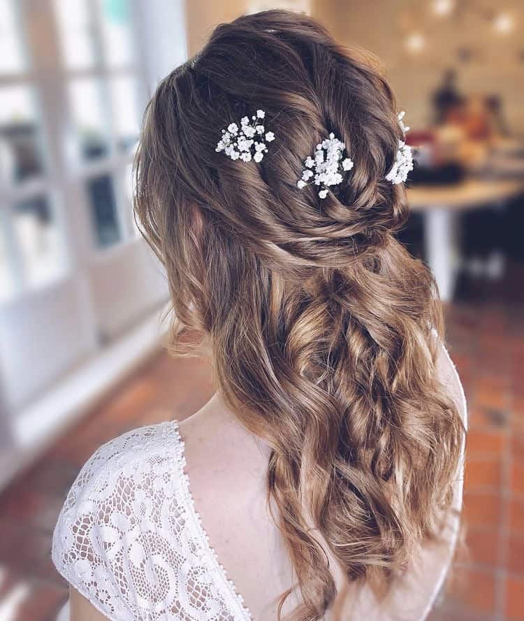 Half up hairstyle with flower details