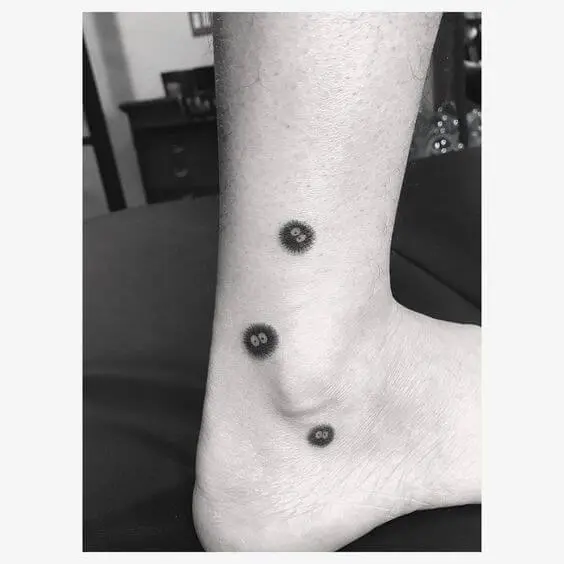 creative soot sprite tattoos on ankle