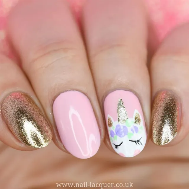 golden glitter with unicorn nail art