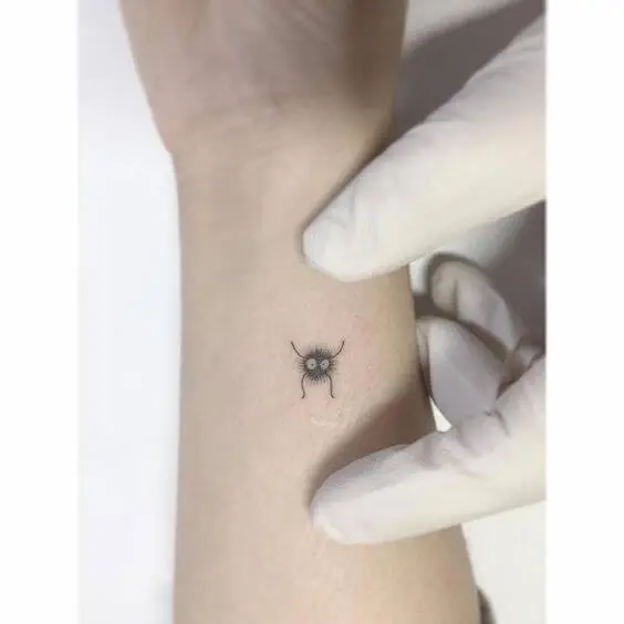 soot sprite tattoo on wrist