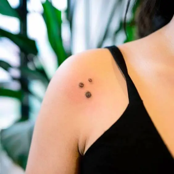 tiny soot sprite tattoos on front shoulder 1