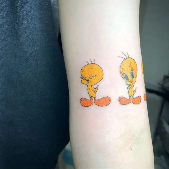 tweety bird tattoos on arm