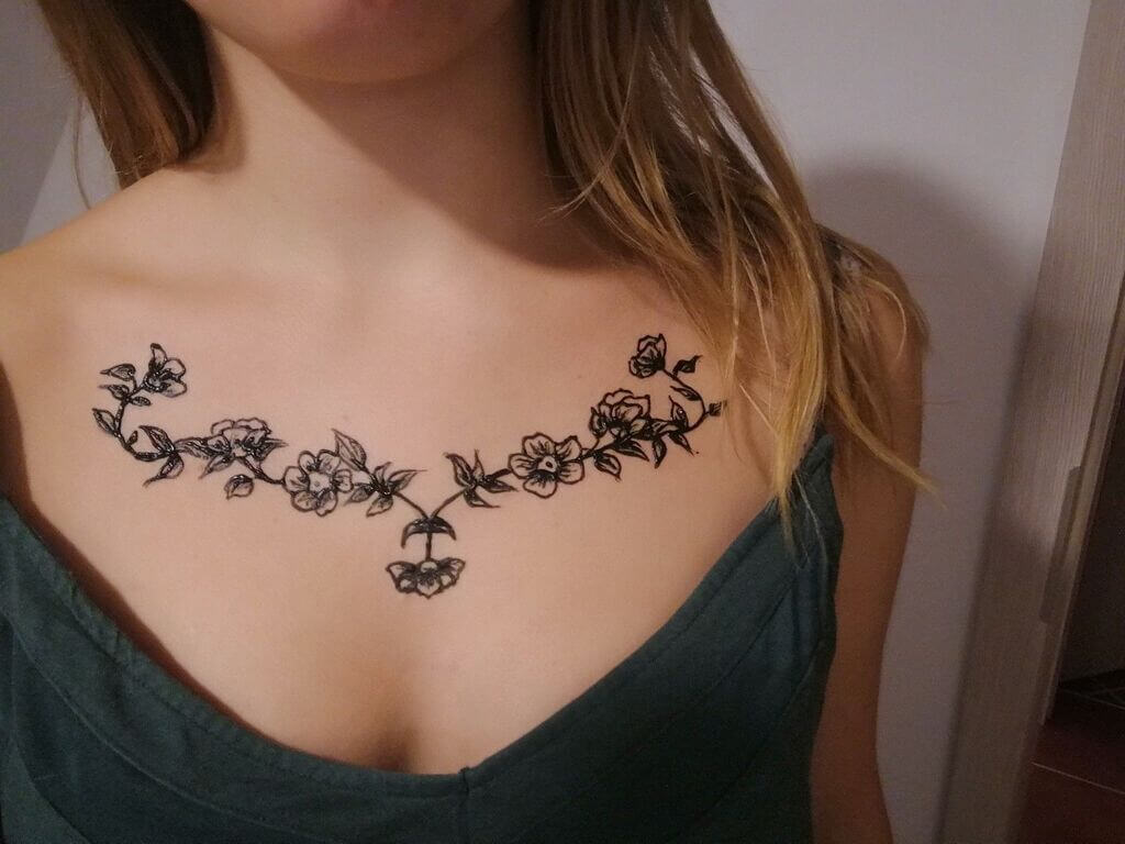 Simple Breast Tattoo Design