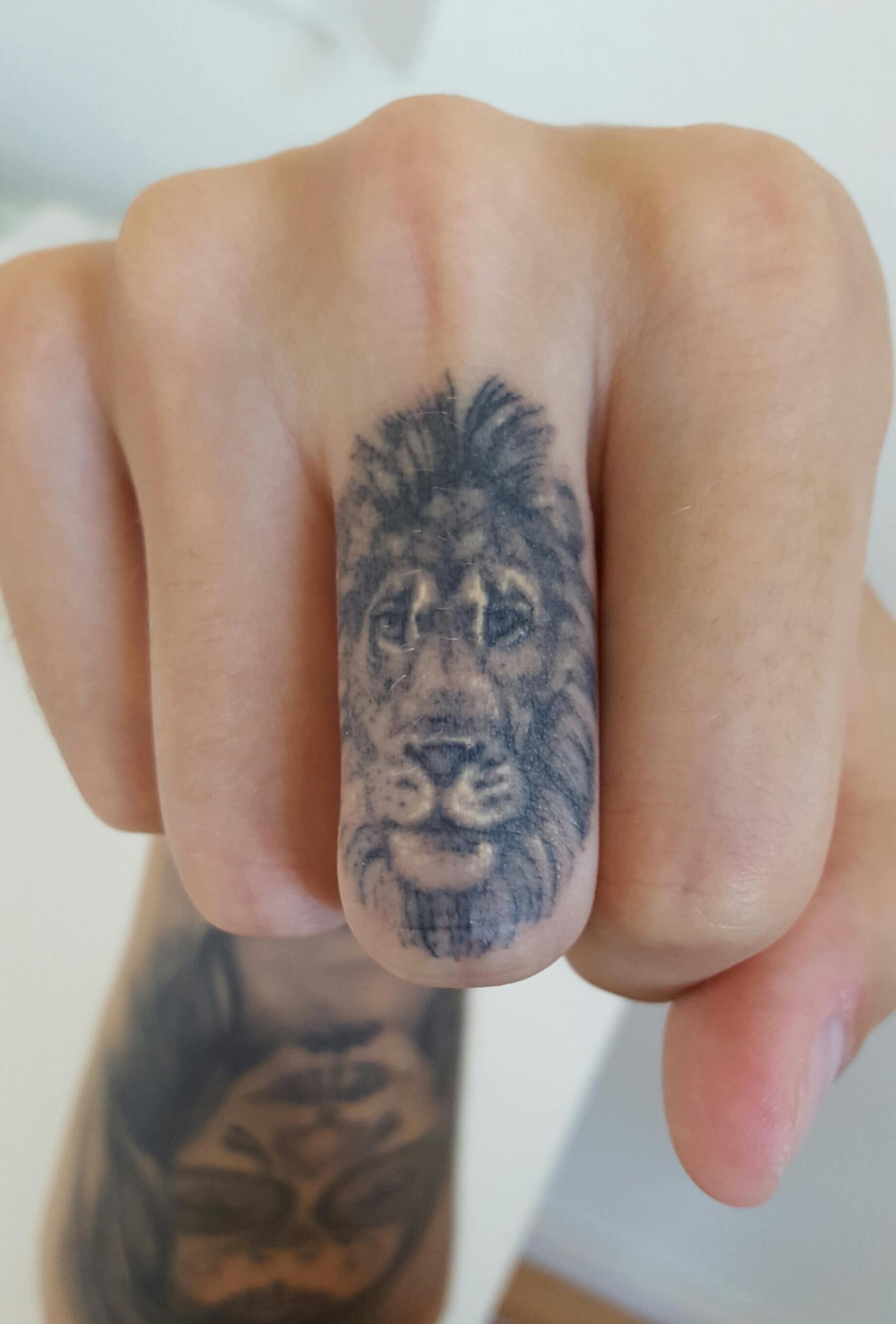 Lion Skull On The Middle Finger
