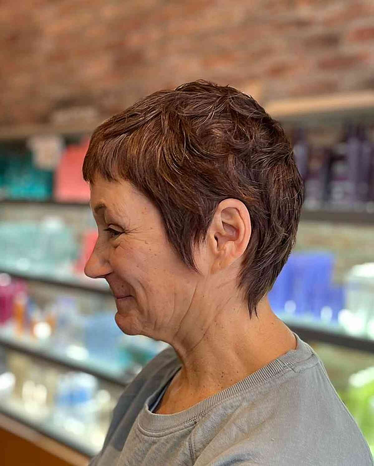 choppy textured pixie shag with mini bangs on women over