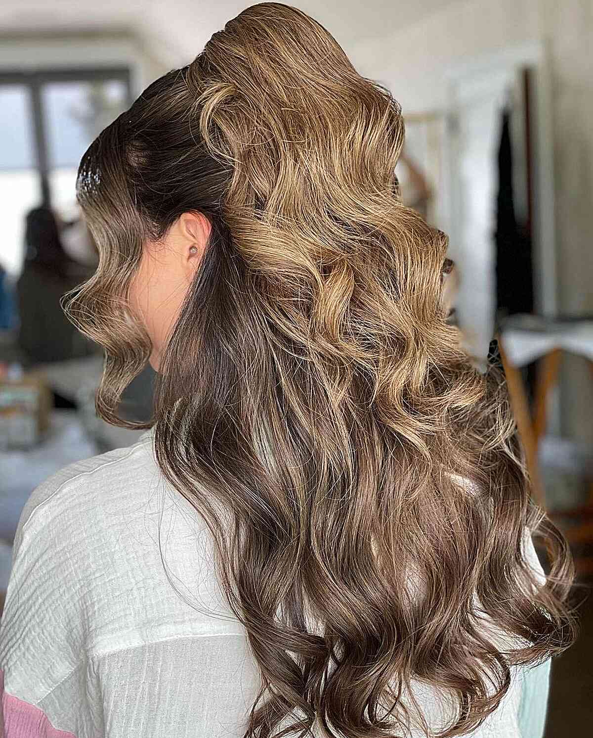 double flip half up ponytail for wedding guests