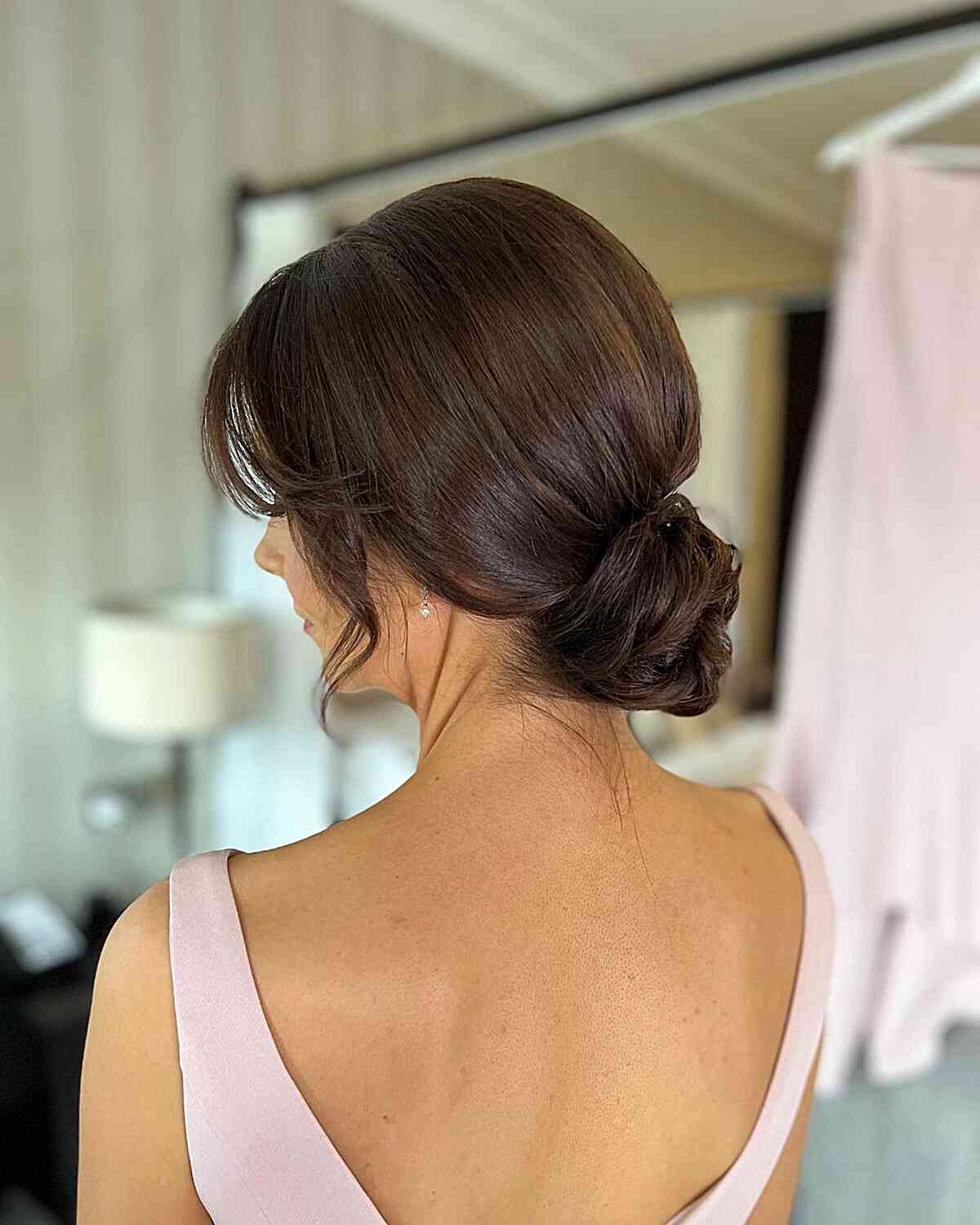 easy loose updo with face framing strands for a wedding guest