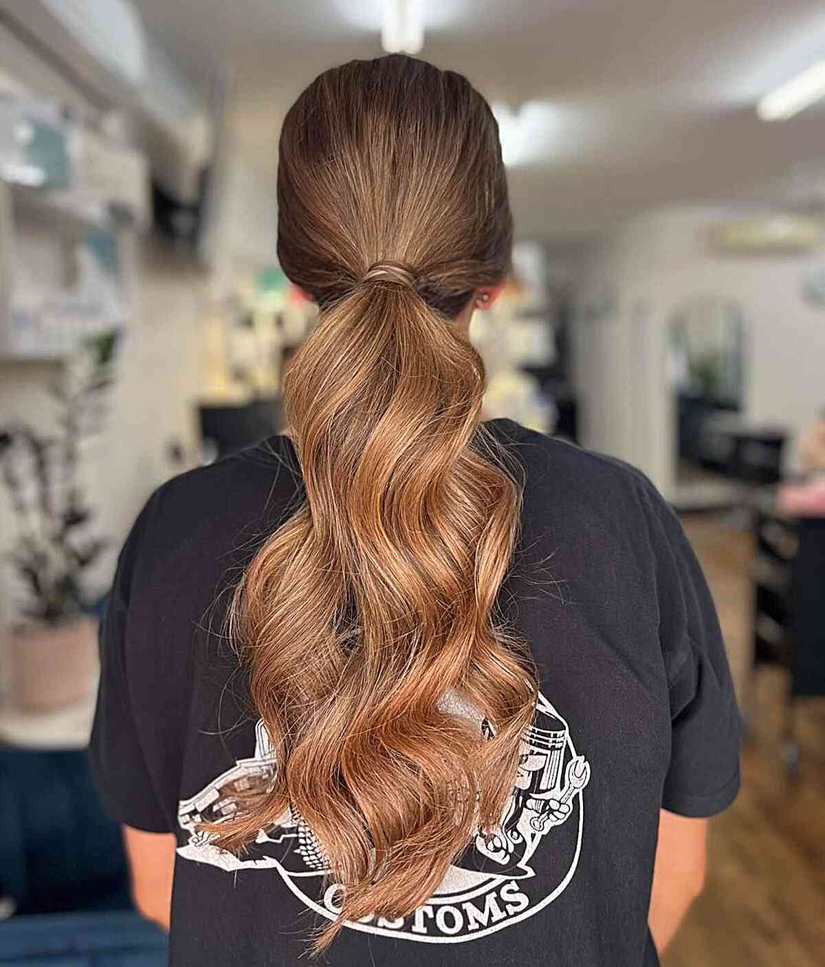 easy low pony with loose waves for graduation