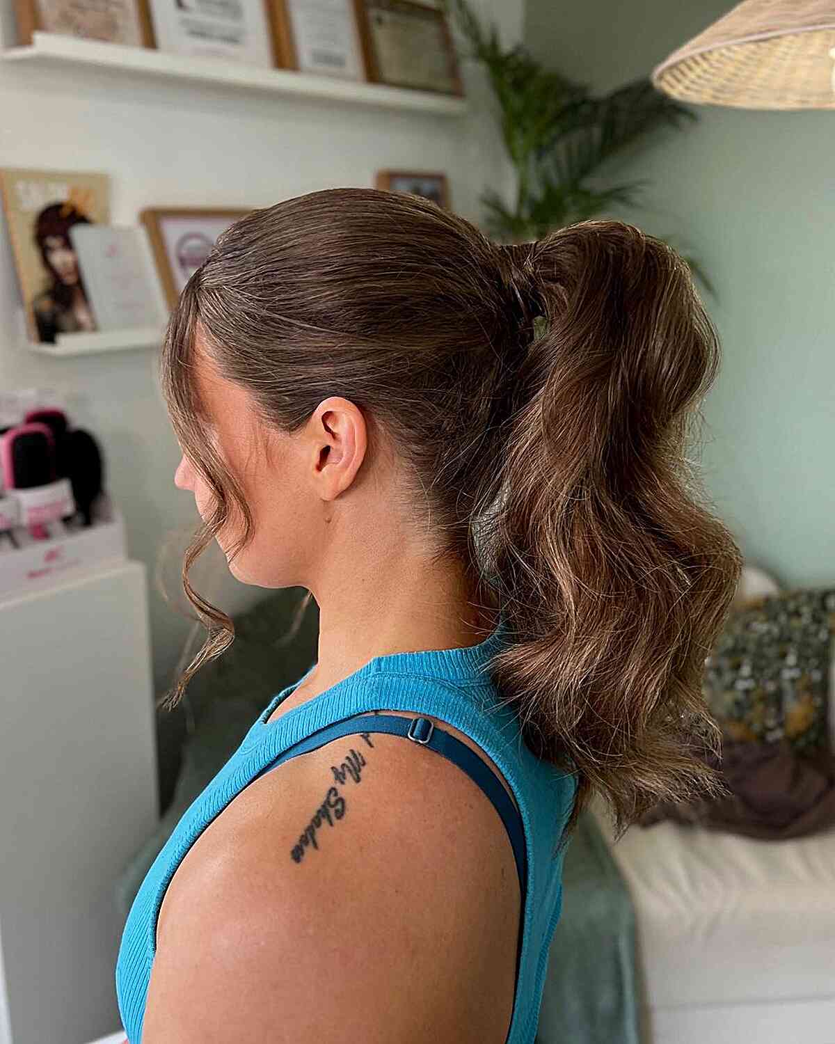 easy ponytail with thick waves for a guest of a wedding