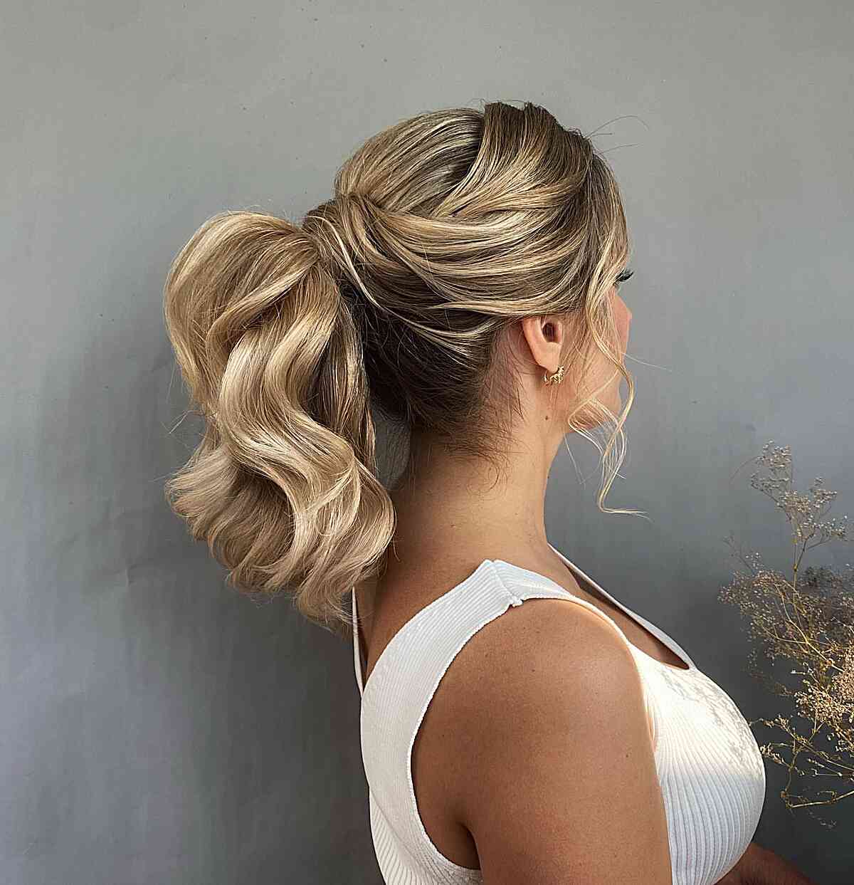 easy voluminous ponytail wedding guest style for thick hair