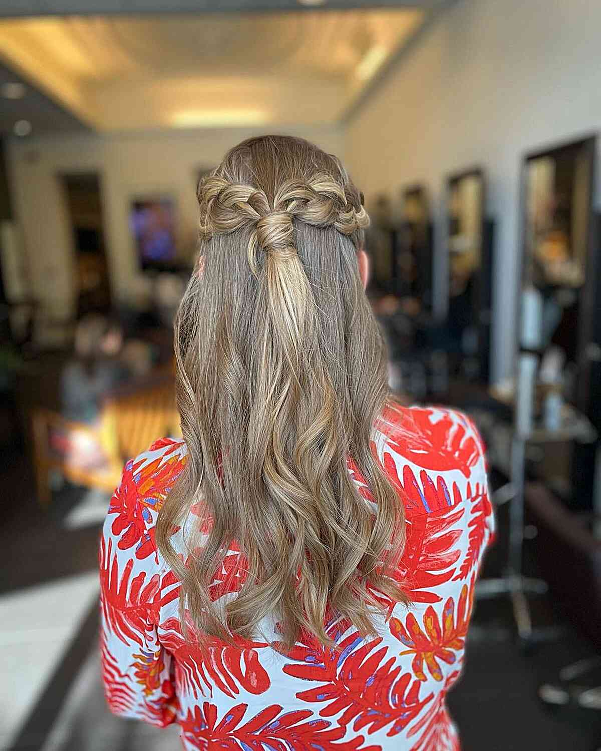 half upstyle with pull through braid for wedding guests
