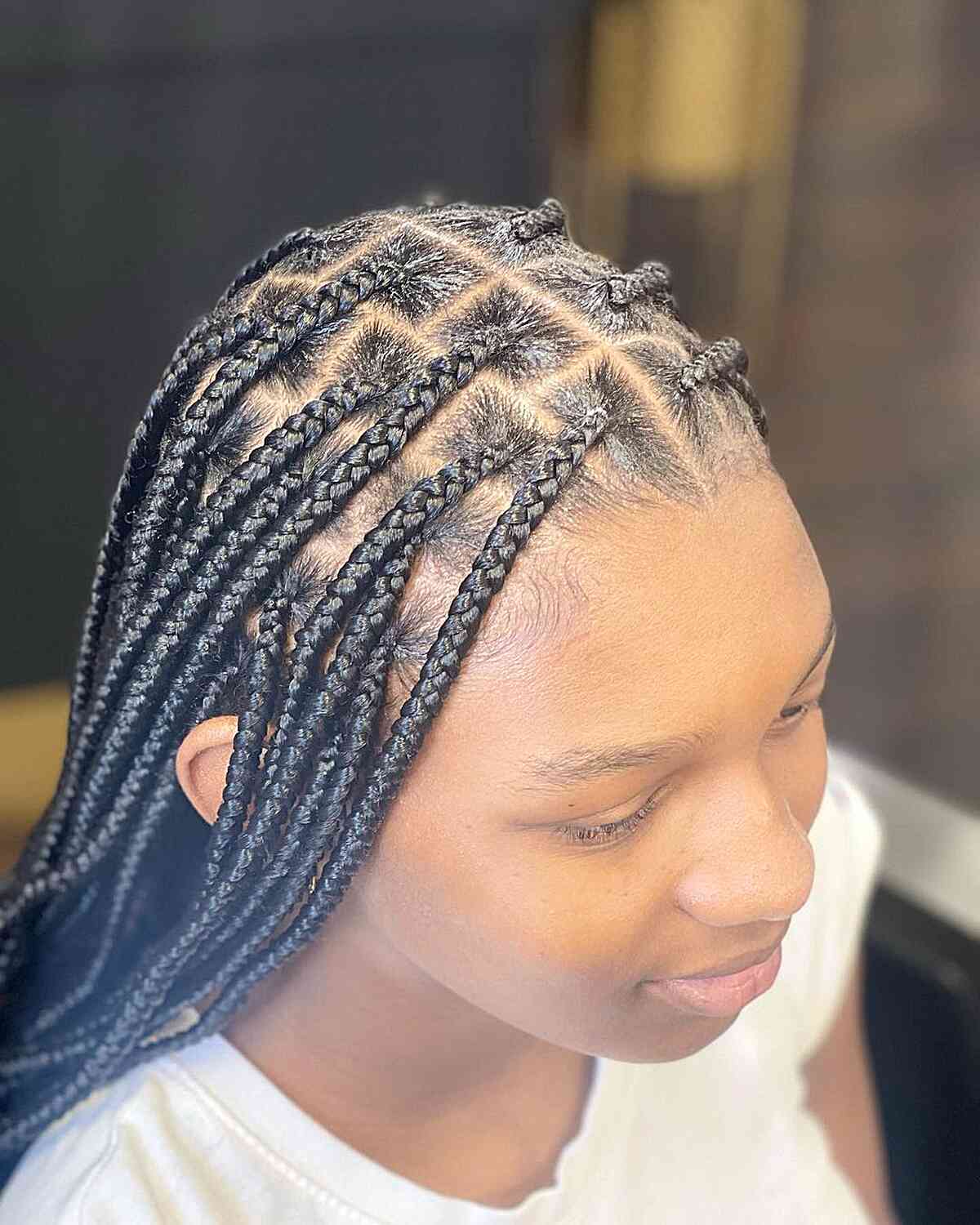 mini knotless box braid style with center part
