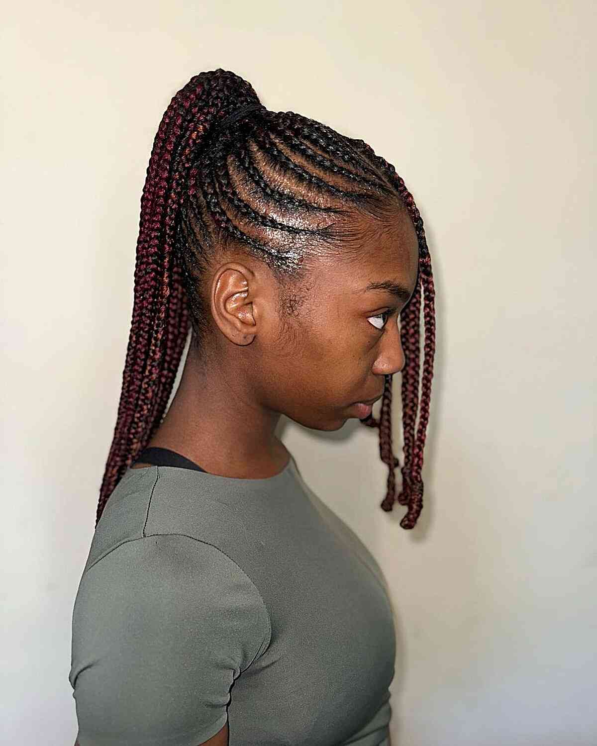 red feed in knotless braids with ponytail